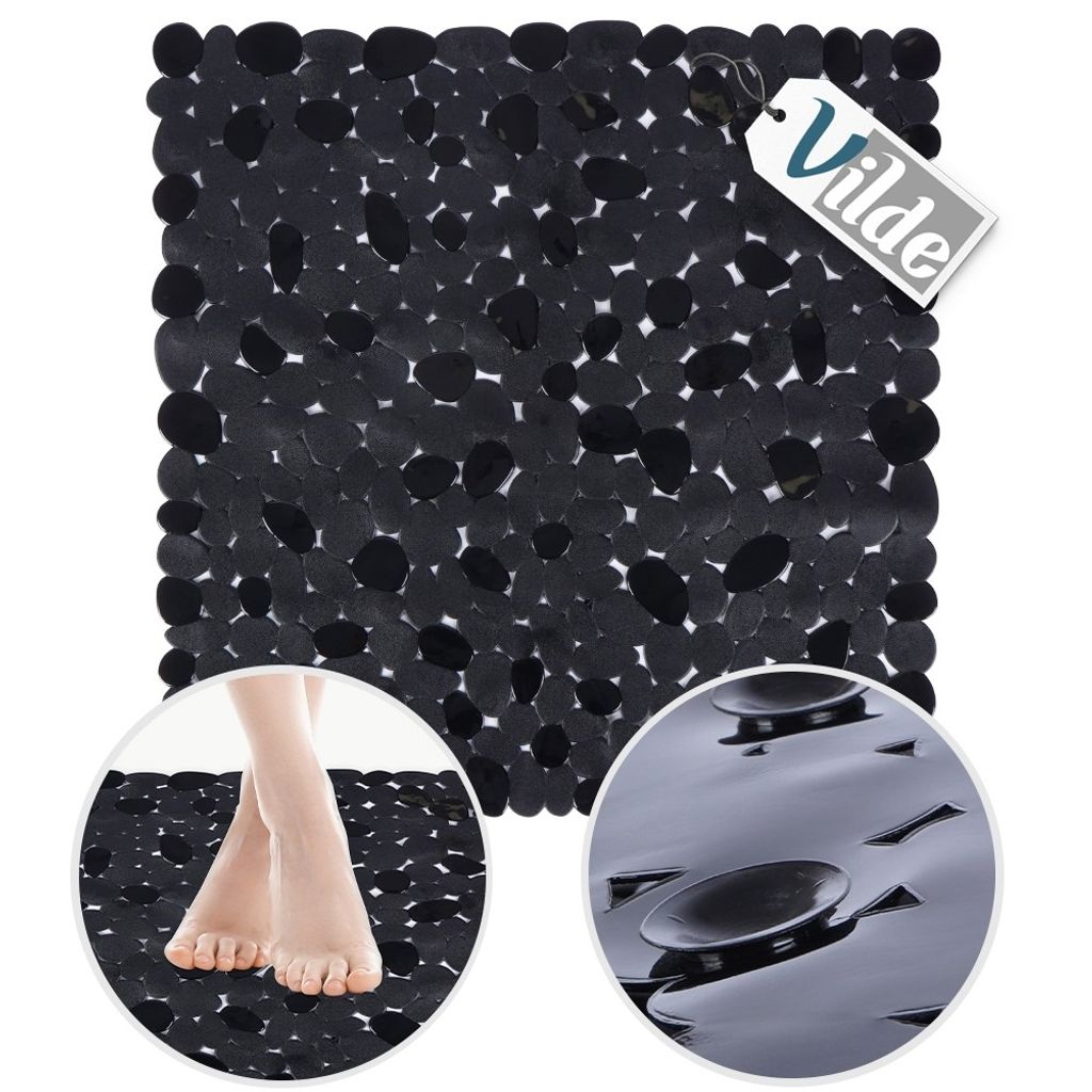 A black anti-slip bath mat with a pebble-like texture, shown with a close-up of feet on the mat and a close-up of the suction cups on the underside.