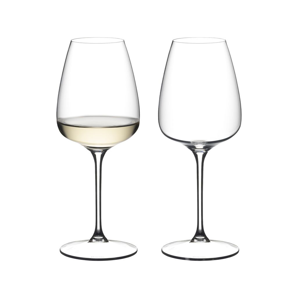 Two wine glasses on a white background. One glass contains white wine.