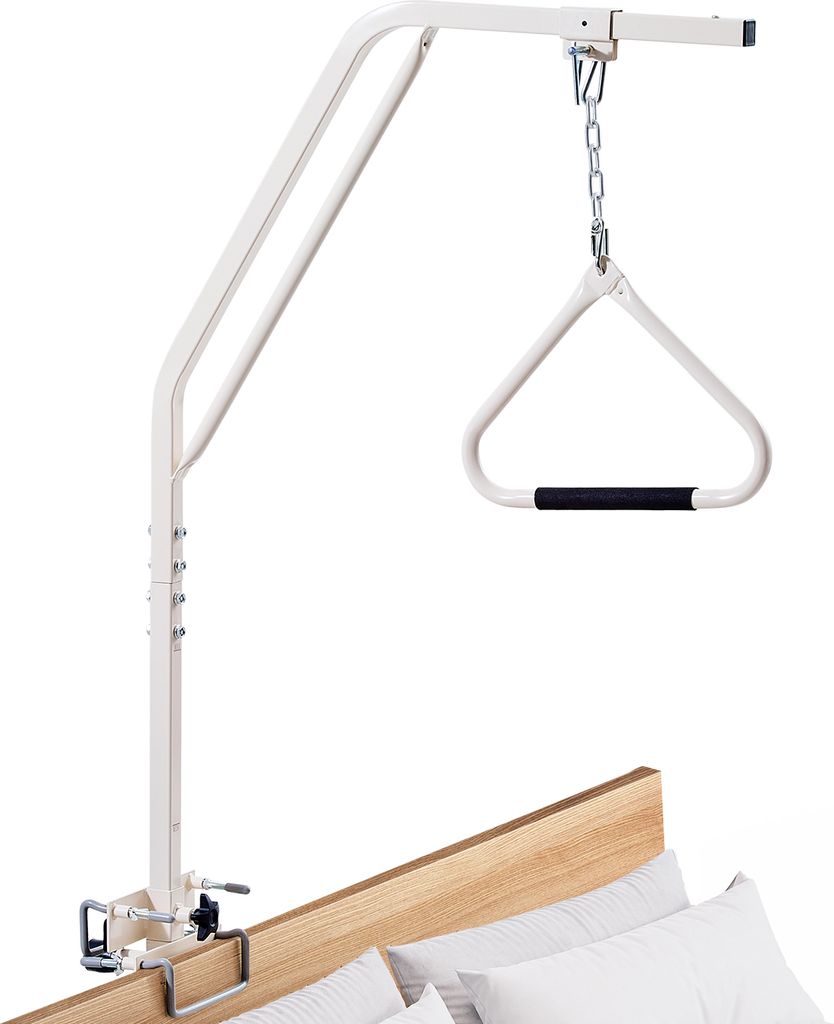 A white bed assist rail with a triangle handle is attached to the side of a bed.