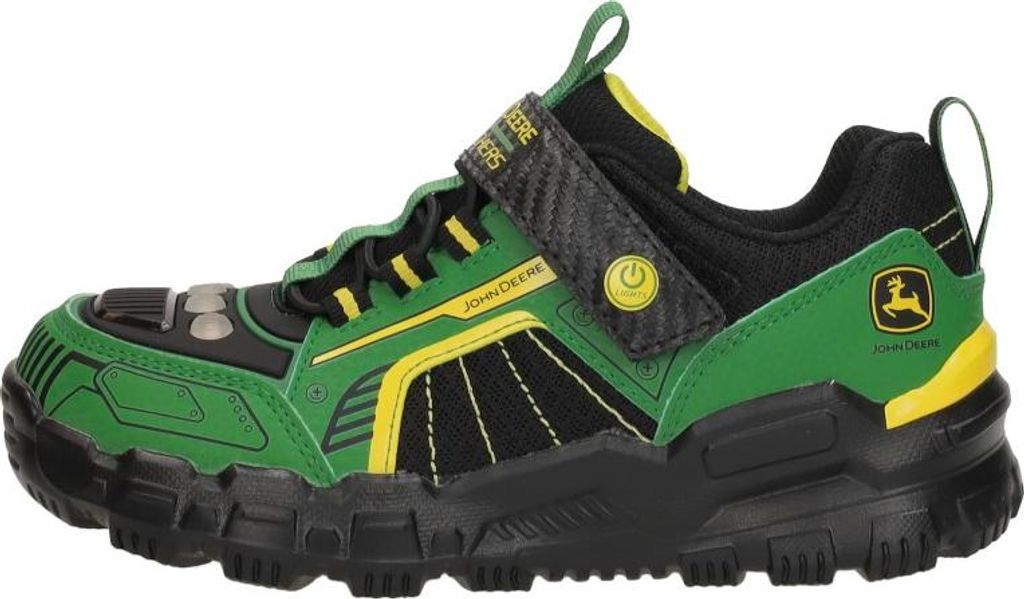 A side view of a single green and black sneaker with yellow accents.