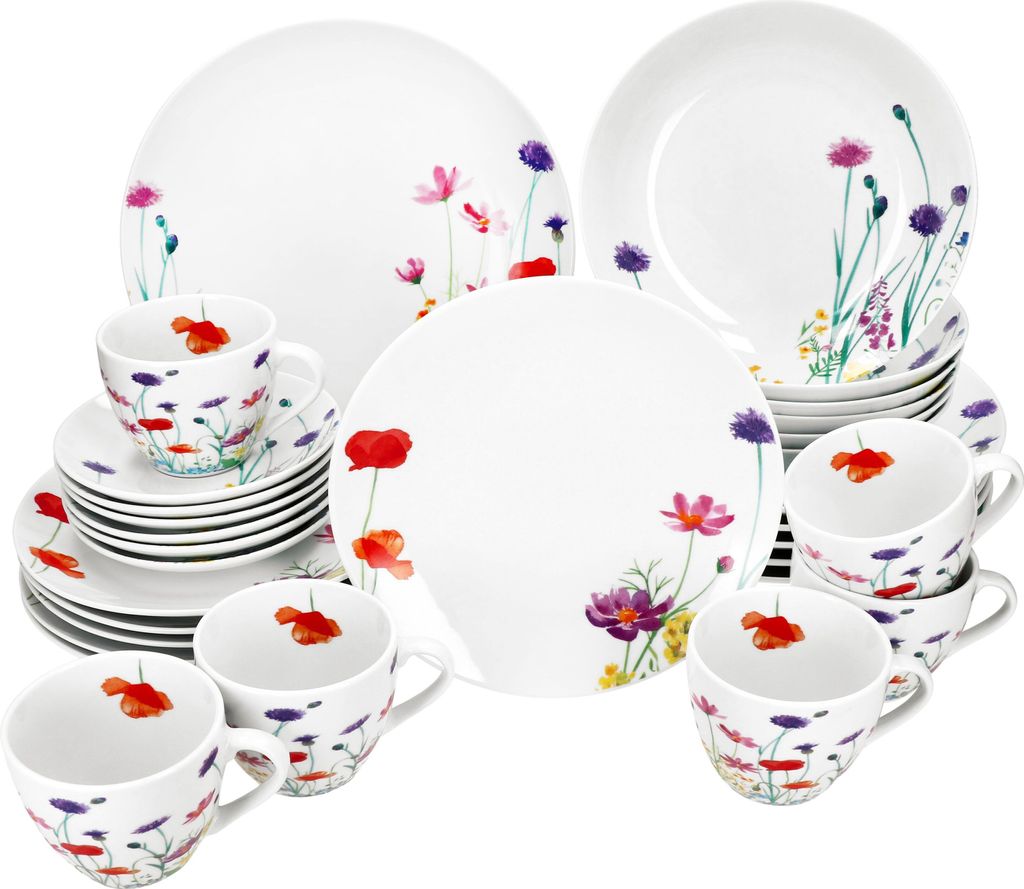 A collection of white porcelain dinnerware with a floral pattern, including plates, cups, and saucers.