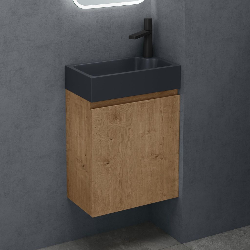 A modern wall-mounted bathroom vanity with a sink and faucet.