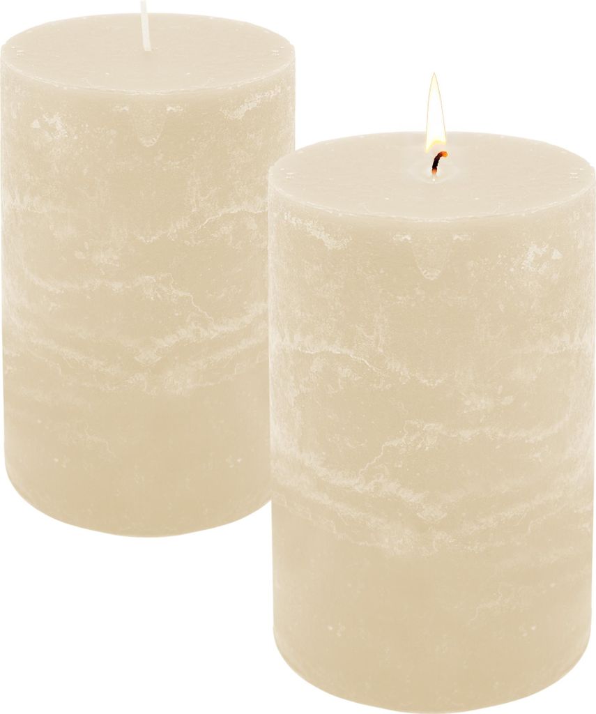 Two cream-colored pillar candles on a white background, one with a lit flame.