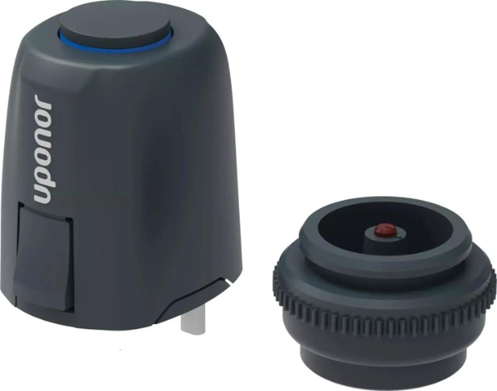 A product shot of a thermostat actuator and its base.
