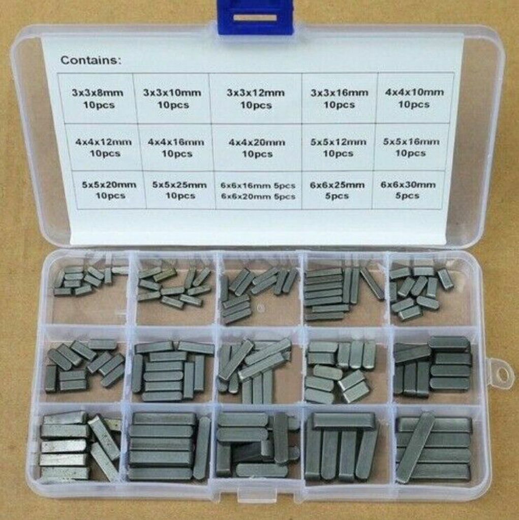 A clear, top-down view of an open plastic organizer box filled with various sizes of metal parallel keys.
