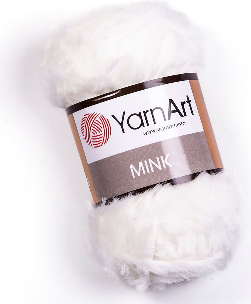 A ball of white, fluffy yarn with a label.