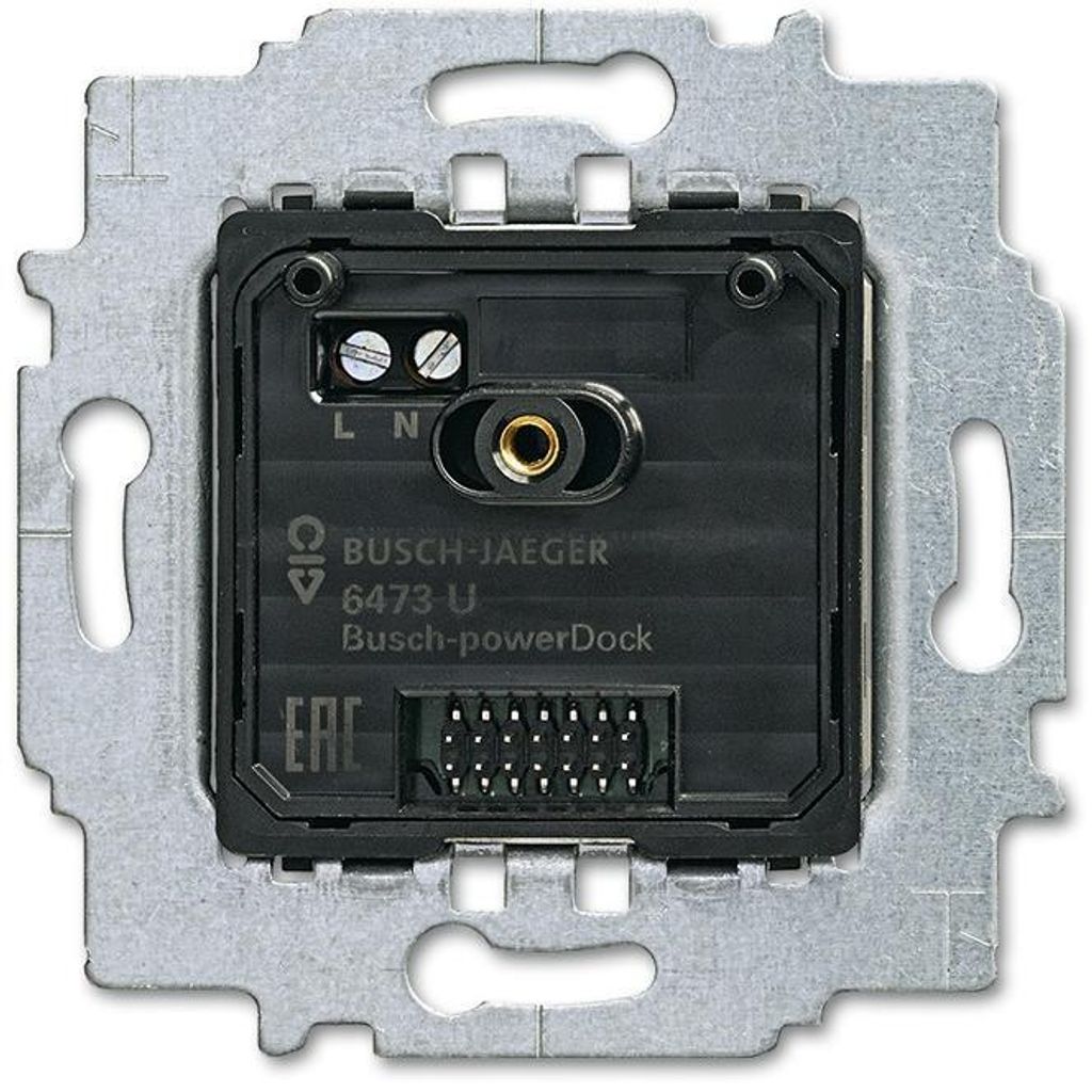 The back of a Busch-Jaeger power supply unit is shown, mounted on a metal frame.