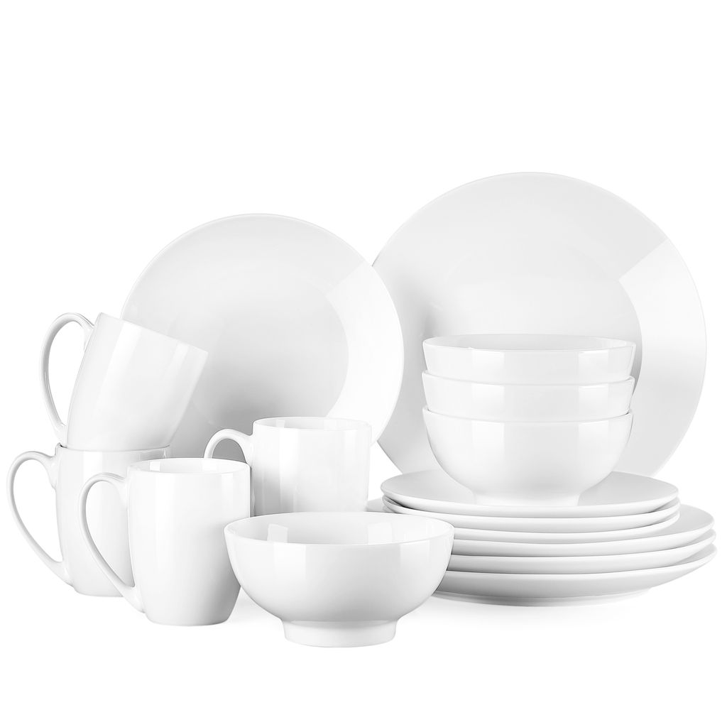 A collection of white ceramic dinnerware, including plates, bowls, and mugs, arranged against a white background.