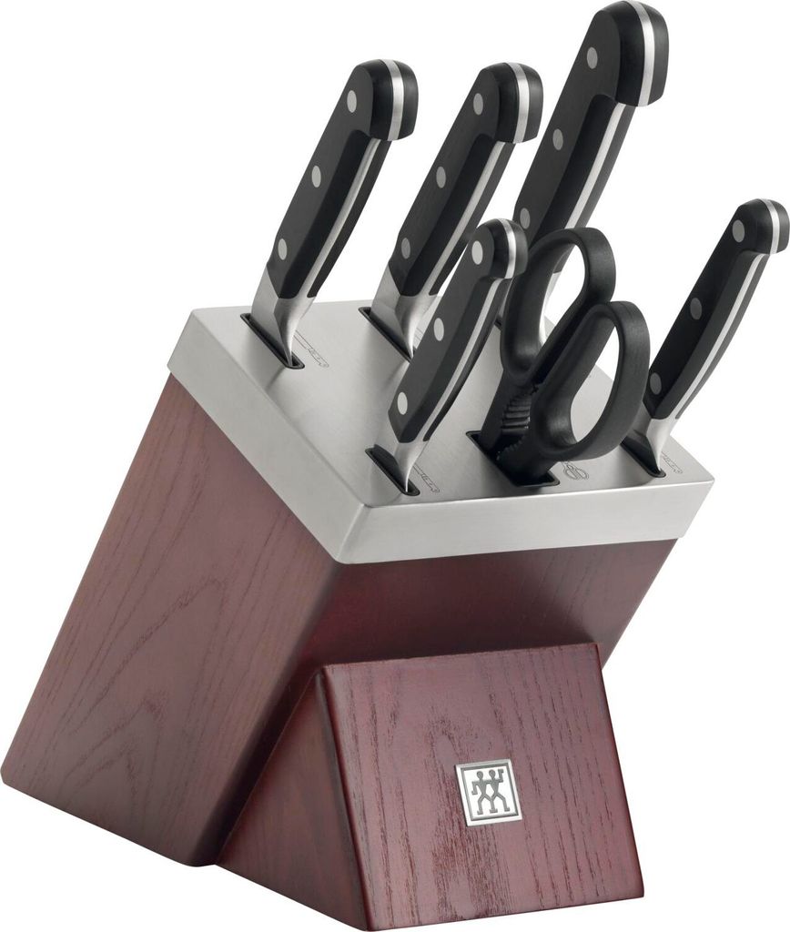 A set of kitchen knives in a wooden block.