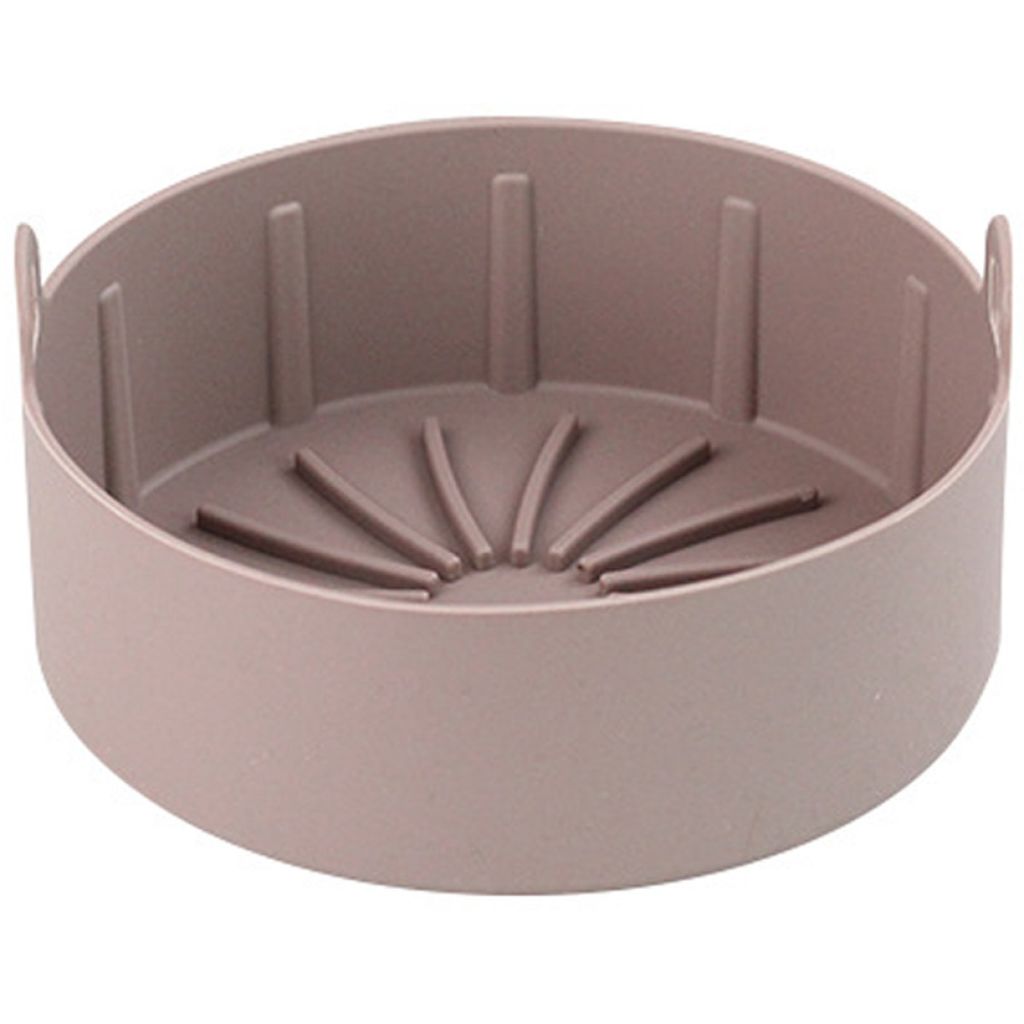 A pink silicone pot liner for an air fryer, shown from a slightly elevated side angle on a white background.