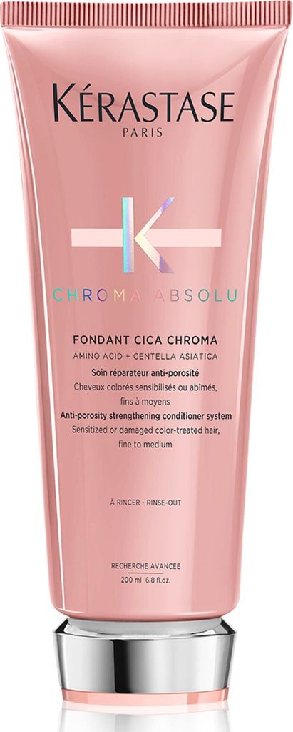 A pink tube of Kerastase conditioner with silver accents.