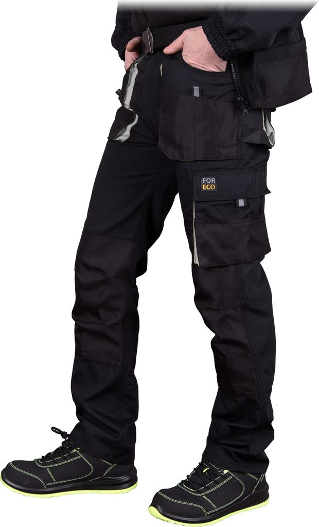 A person wearing black work pants and shoes.