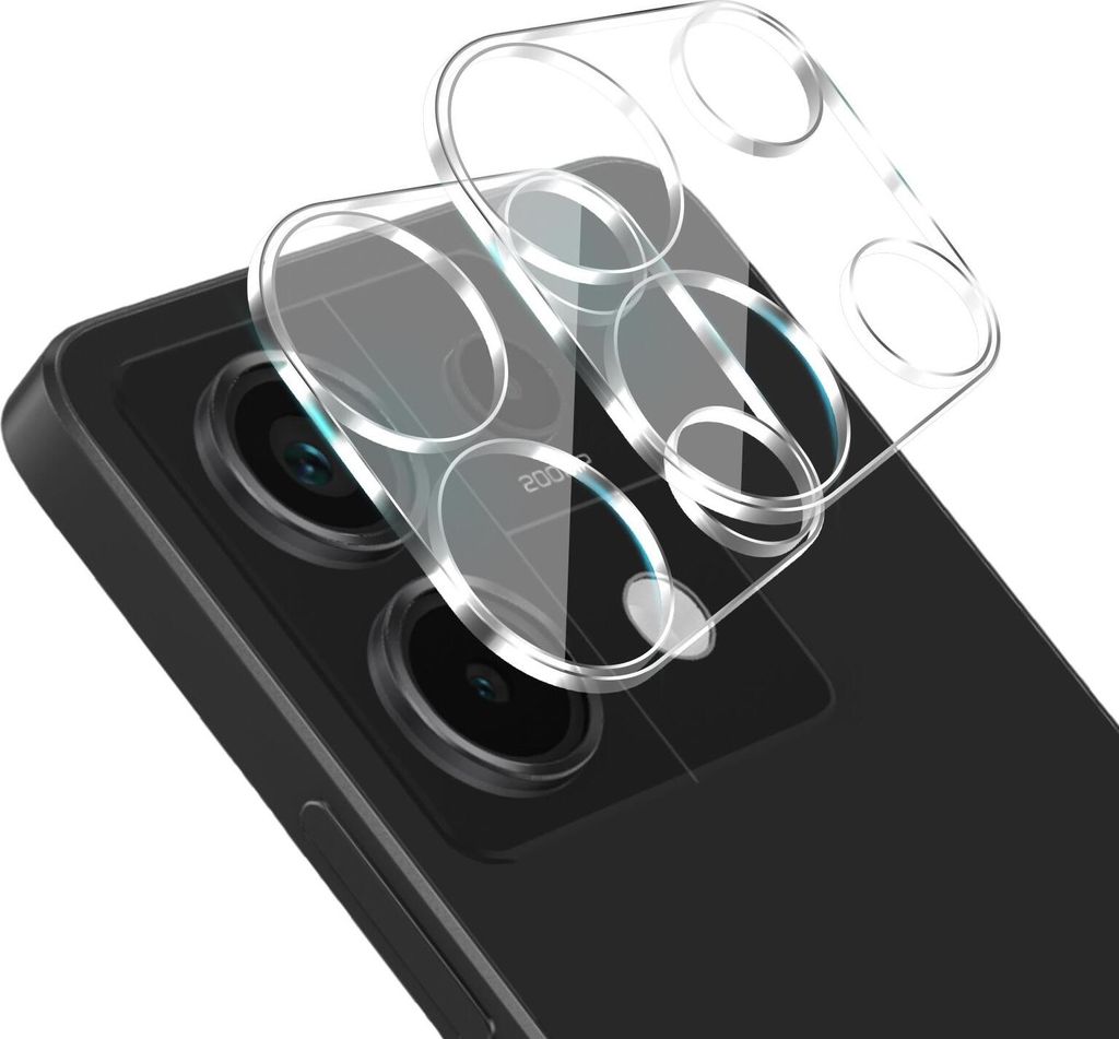 A close-up shot of a phone's camera lens protector being placed on a black smartphone.