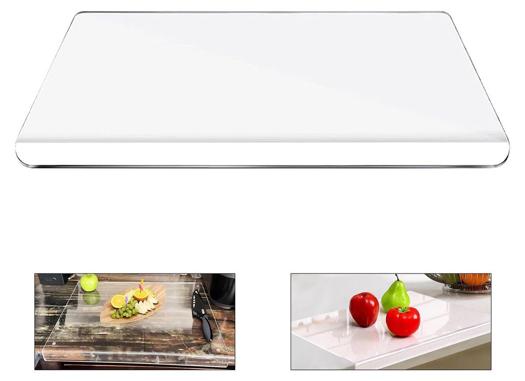 A clear, rectangular cutting board with rounded edges, shown from a slightly elevated angle.