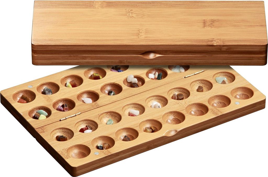 A wooden game board with a lid, filled with small stones.