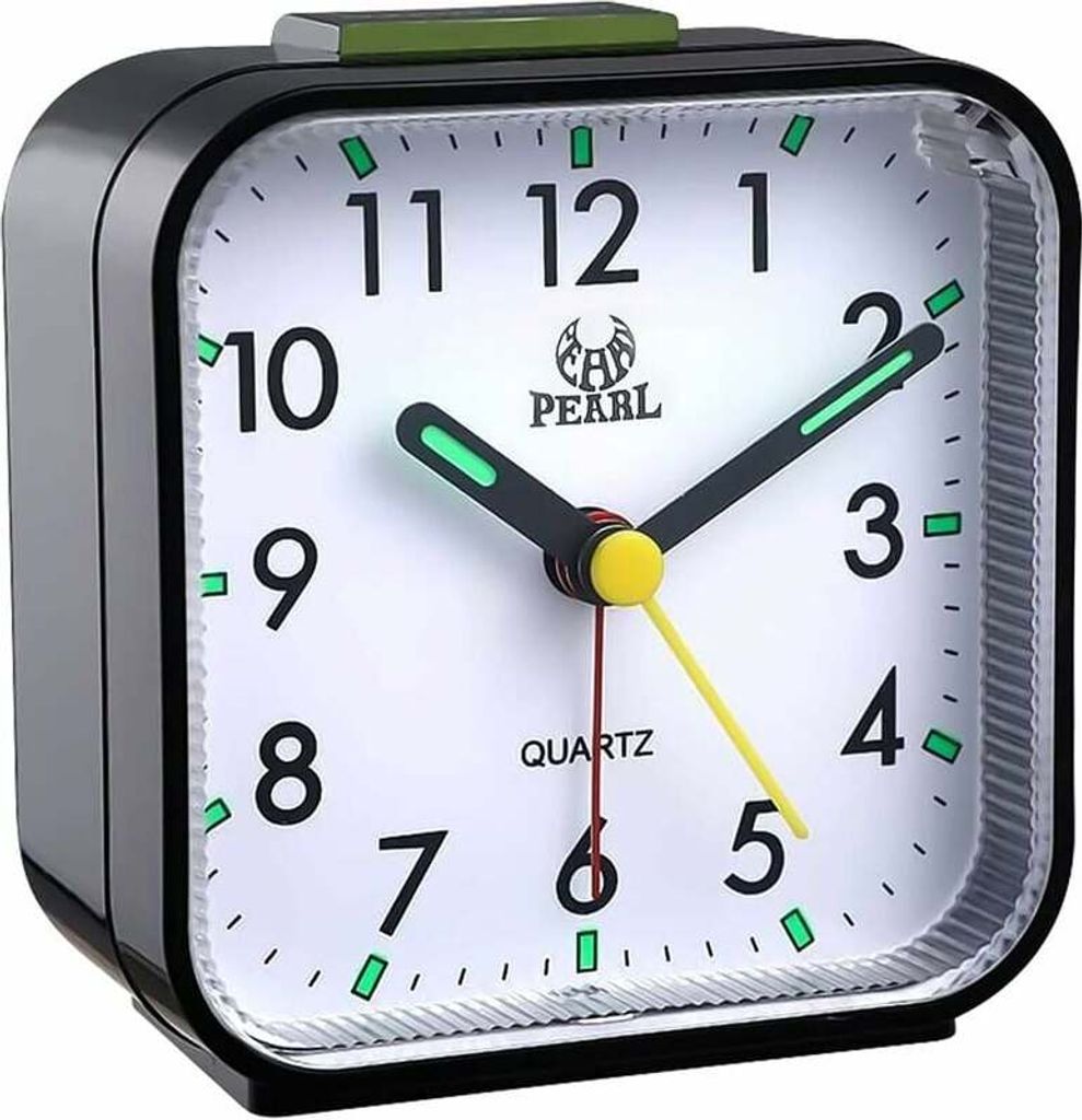 A close-up view of a black analog alarm clock with a white face.