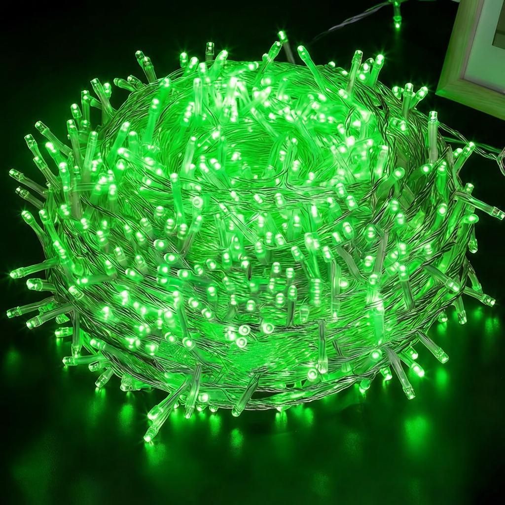 A tightly wound ball of green LED string lights.