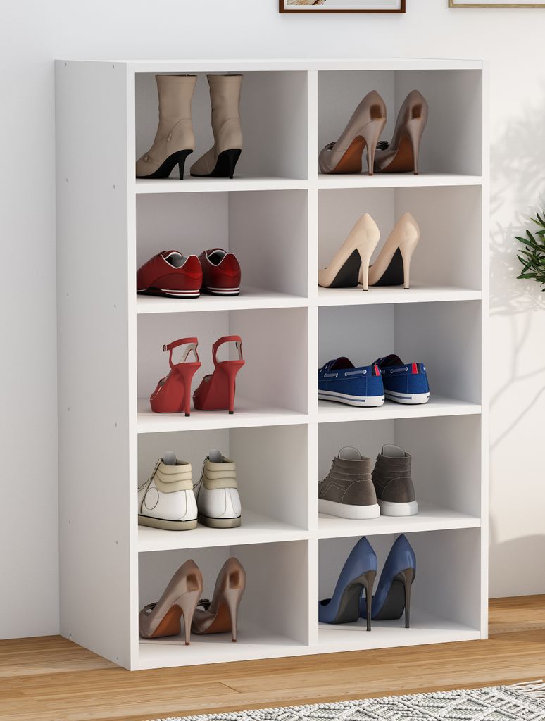 A white shoe rack filled with various pairs of shoes.