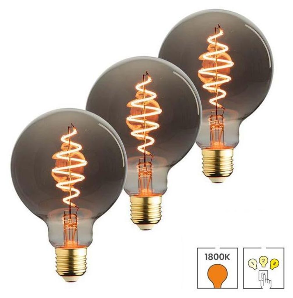 Three smoke-colored globe LED light bulbs with spiral filaments are arranged diagonally on a white background.