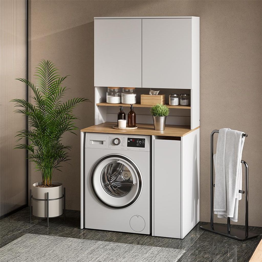 A modern laundry room setup with a washing machine, cabinets, and shelving.