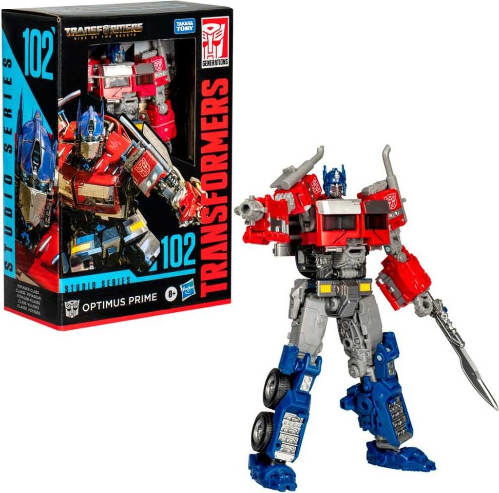The image shows a Transformers Generations Studio Series Voyager Class Optimus Prime action figure and its packaging.