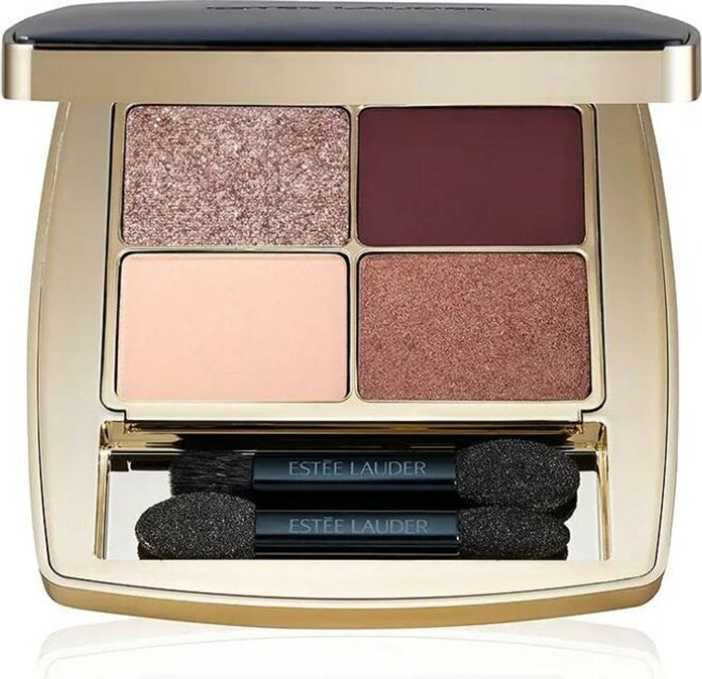 An open Estée Lauder eyeshadow palette with four shades and two applicators.