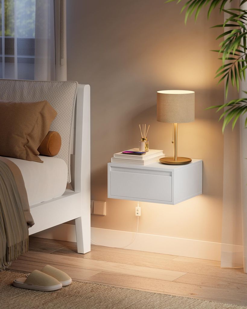 A bedside scene with a floating nightstand, a lamp, and a bed.