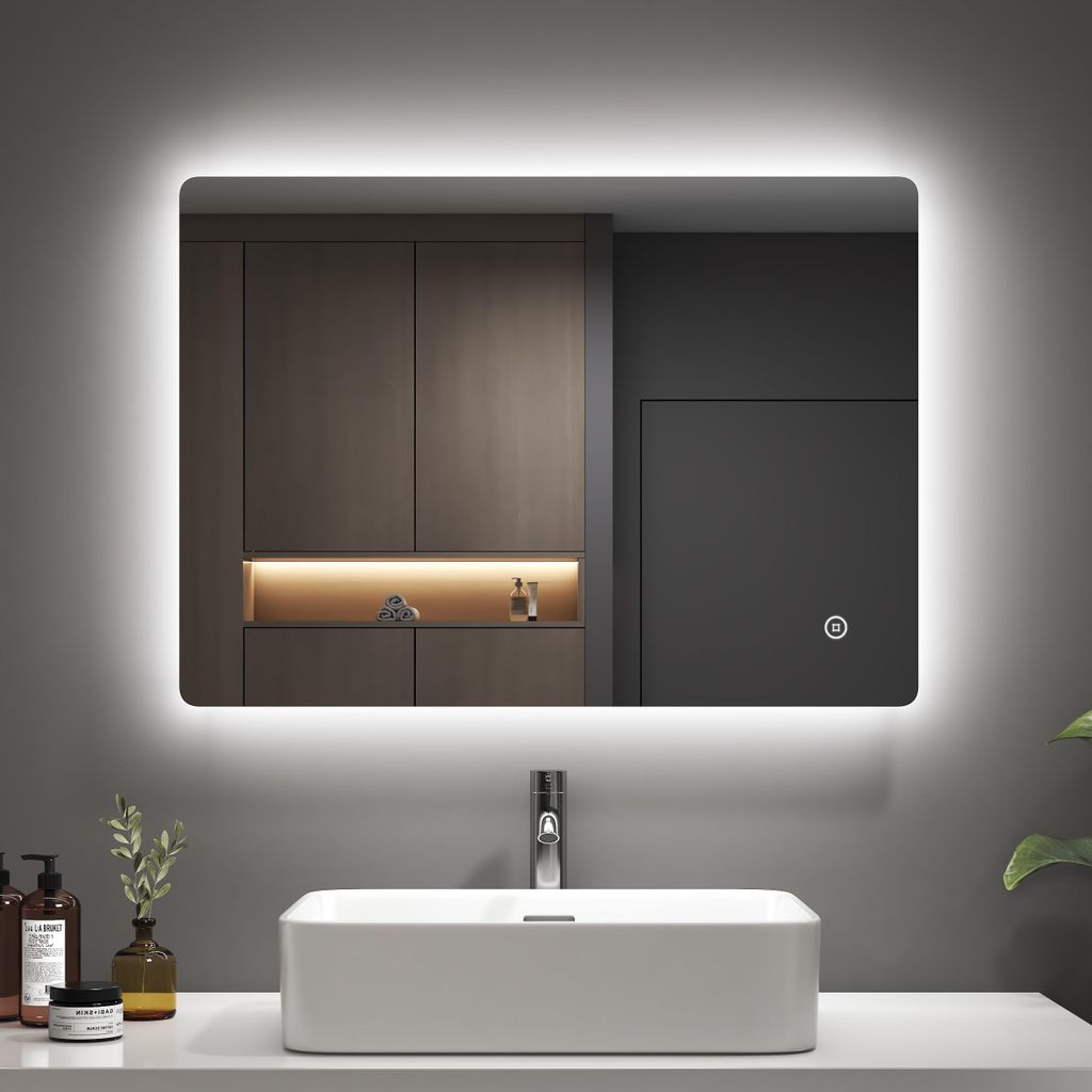 A modern bathroom vanity with a rectangular sink and a backlit LED mirror above it.