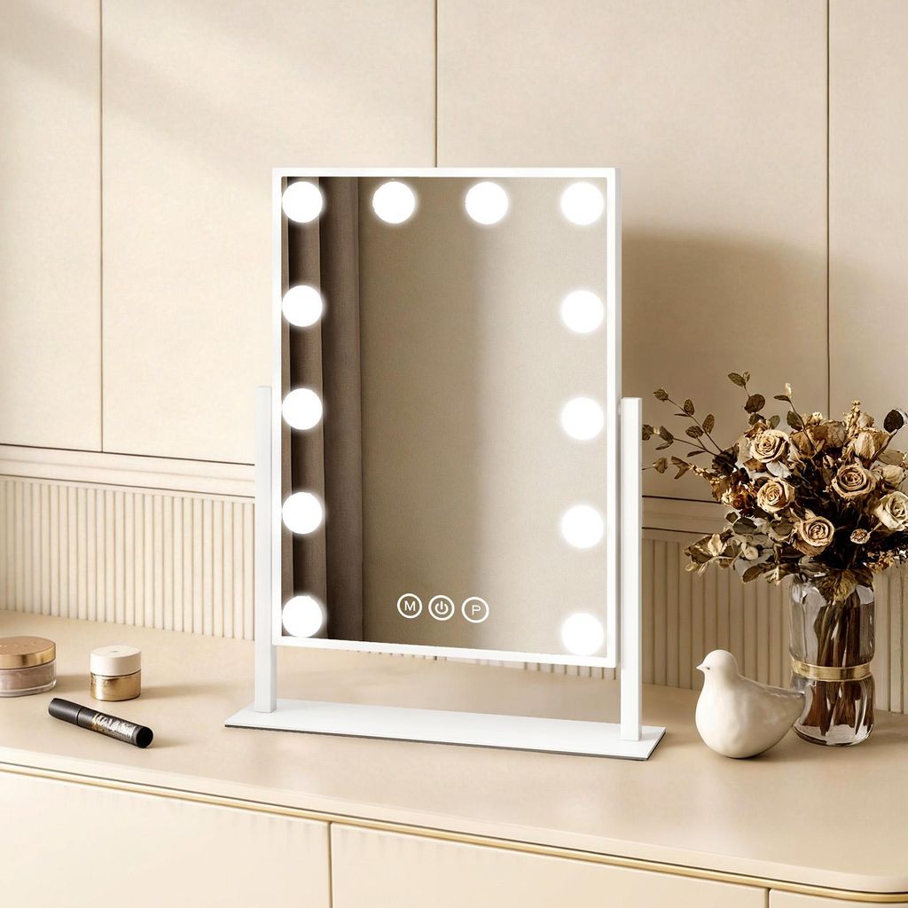 A white makeup mirror with LED lights is displayed on a vanity table.