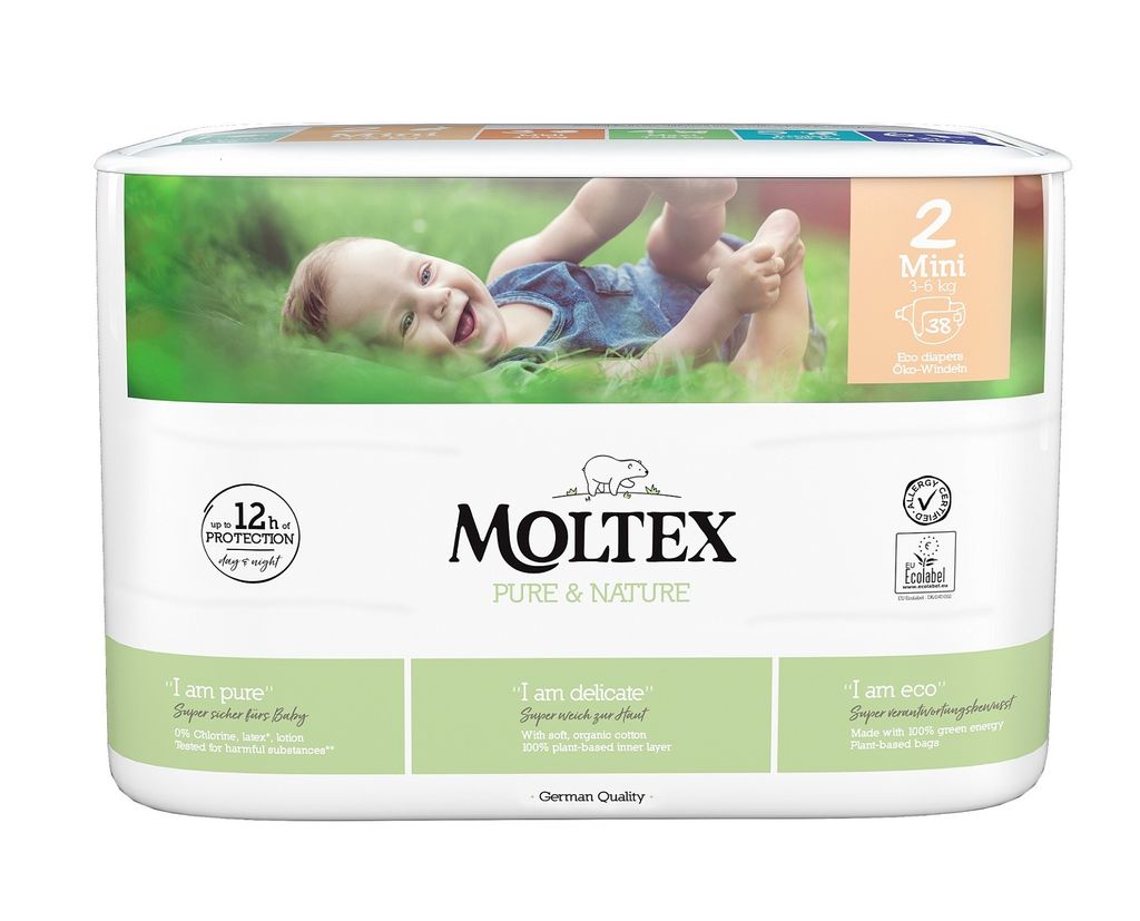 A package of Moltex Pure & Nature diapers with a baby lying on grass.