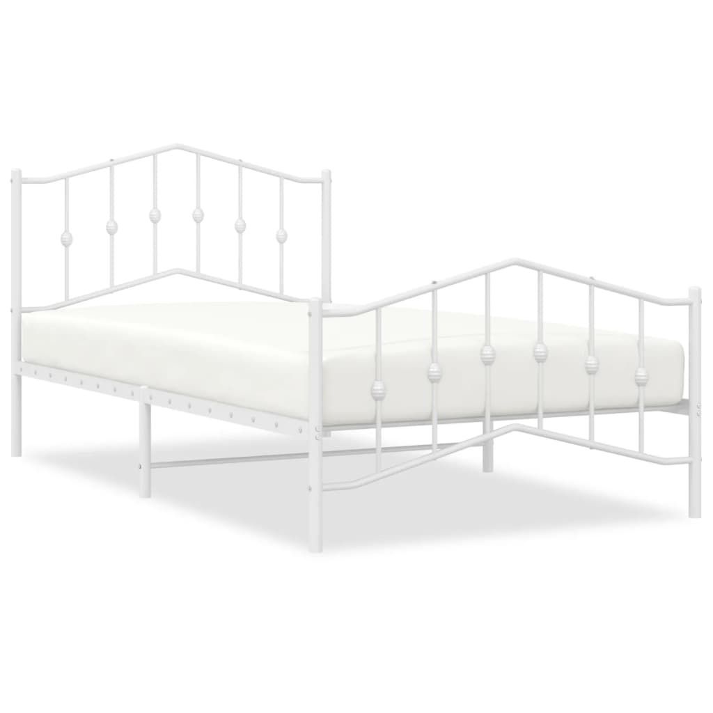 A white metal bed frame with a mattress.