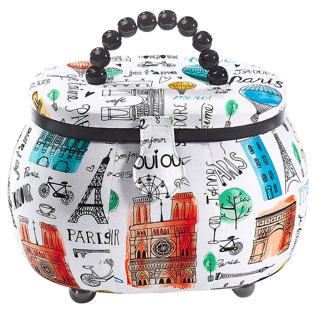 A sewing basket with a Paris-themed print.