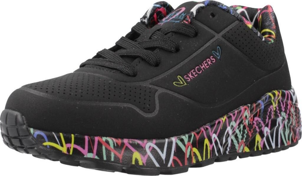 A black sneaker with colorful graffiti-style designs on the sole and lining.