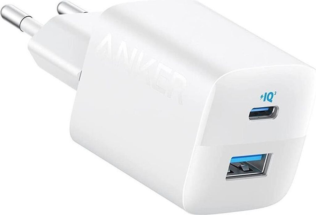 A white Anker 33W charger with two ports (USB-A and USB-C) is shown from a diagonal angle.