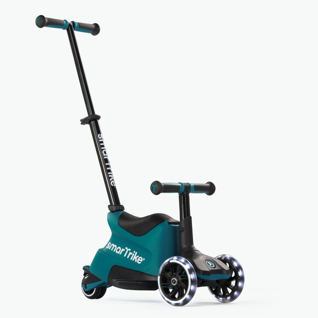 A teal and black SmartTrike Xtend Scooter+Ride On is shown against a white background.