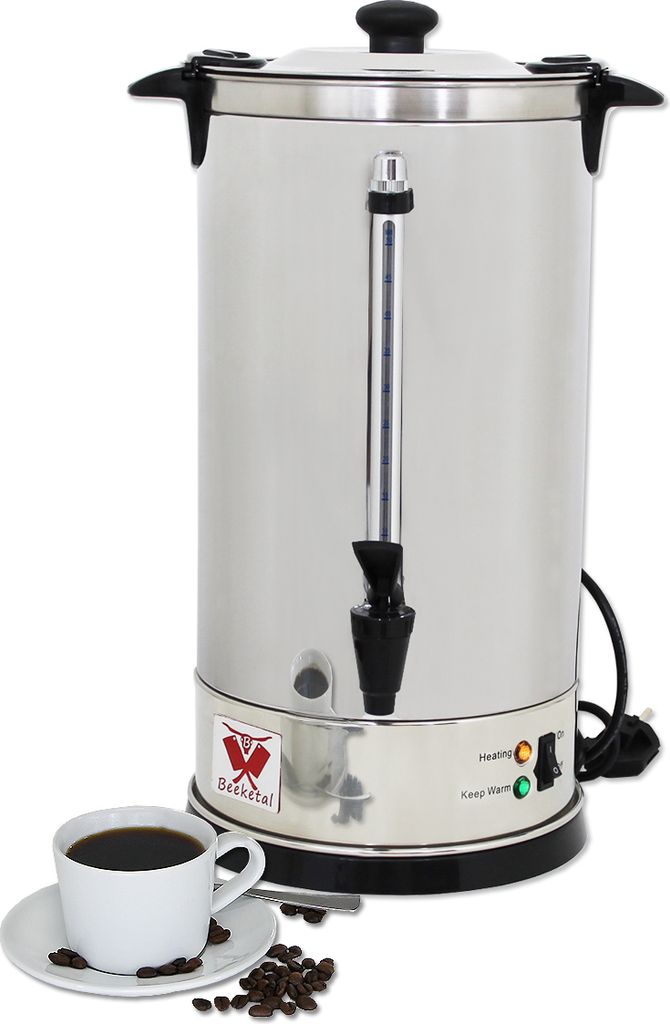A stainless steel coffee urn with a cup of coffee and coffee beans in the foreground.