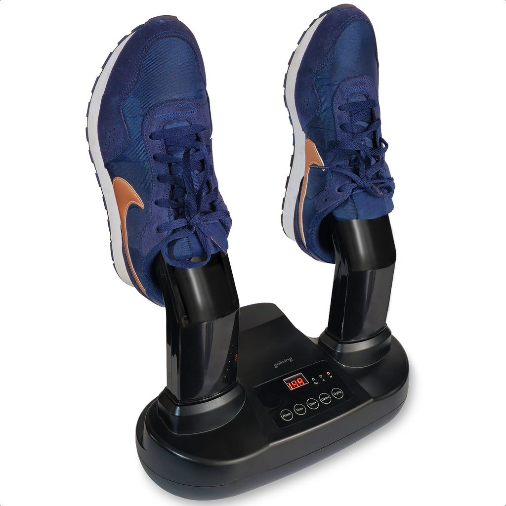 A black electric shoe dryer with two blue sneakers on it.