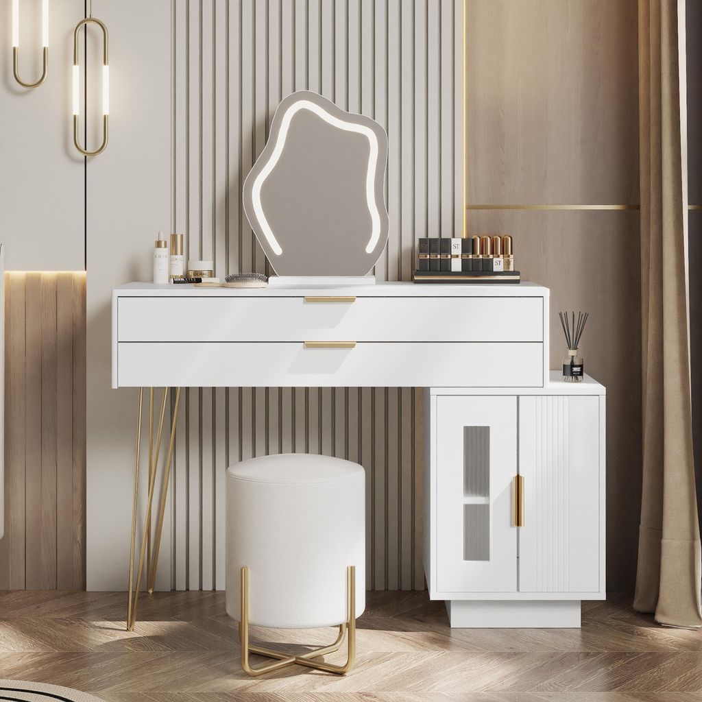 A modern white vanity table with a unique LED mirror and a matching stool, set against a textured wall.