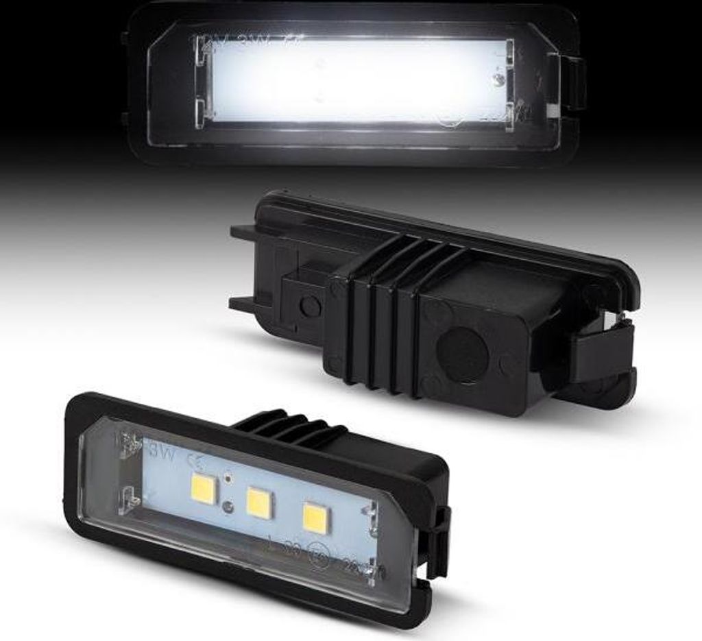 Three views of a car license plate light.