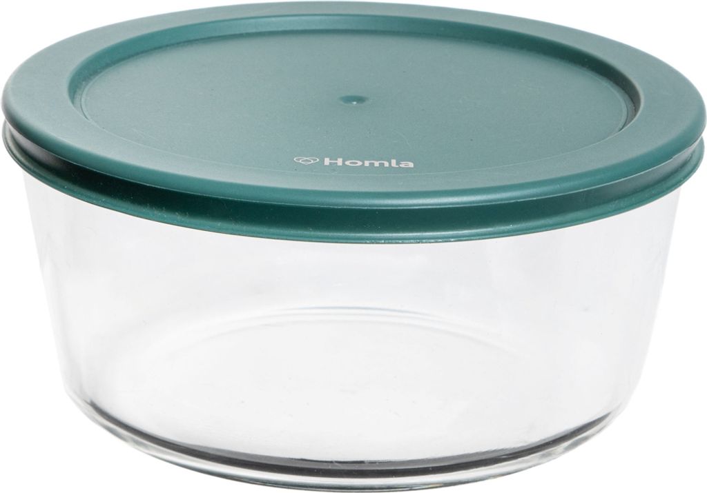 A clear, studio shot of a round glass food storage container with a green lid.