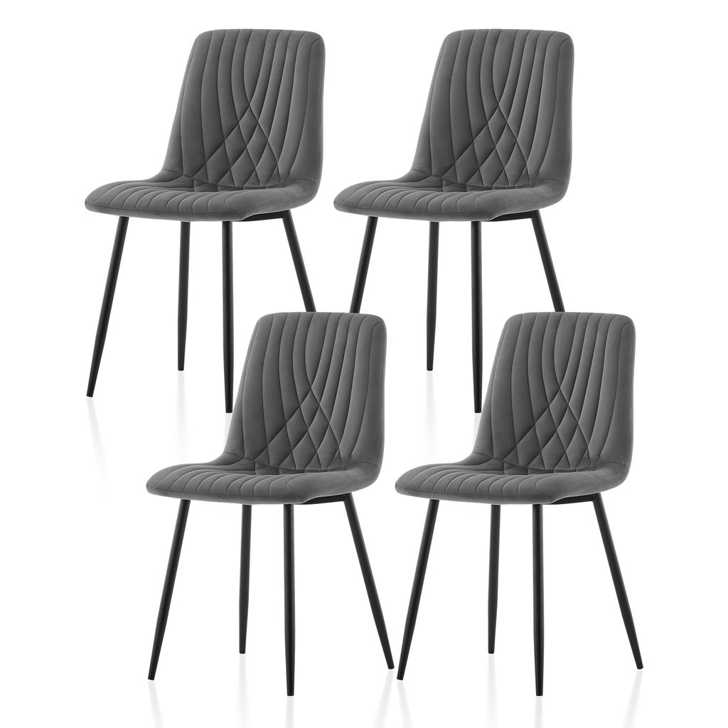 Four gray velvet dining chairs with black legs are arranged in a 2x2 grid against a white background.