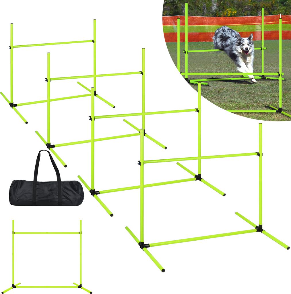 A collection of dog agility hurdles and a carrying bag are displayed on a grassy surface with a blurred background.