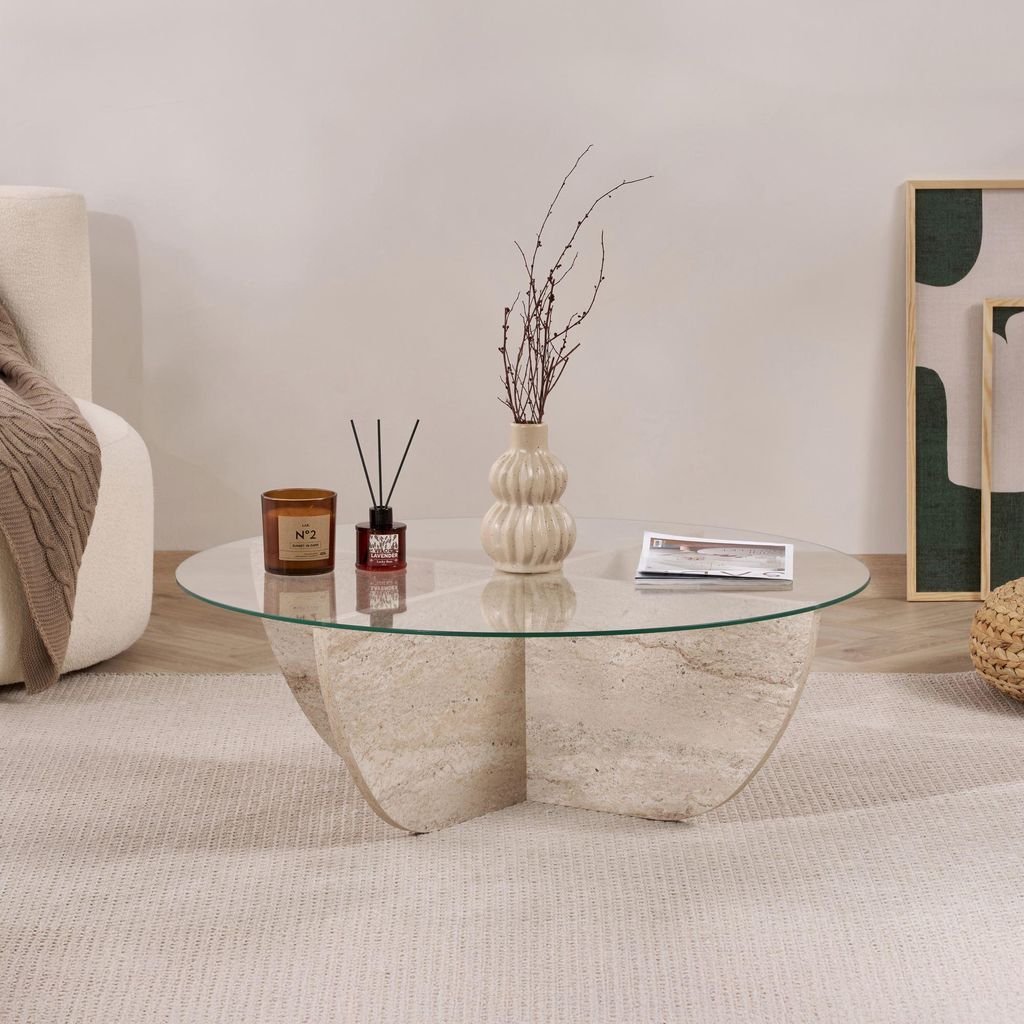 A coffee table with decorative items in a living room setting.