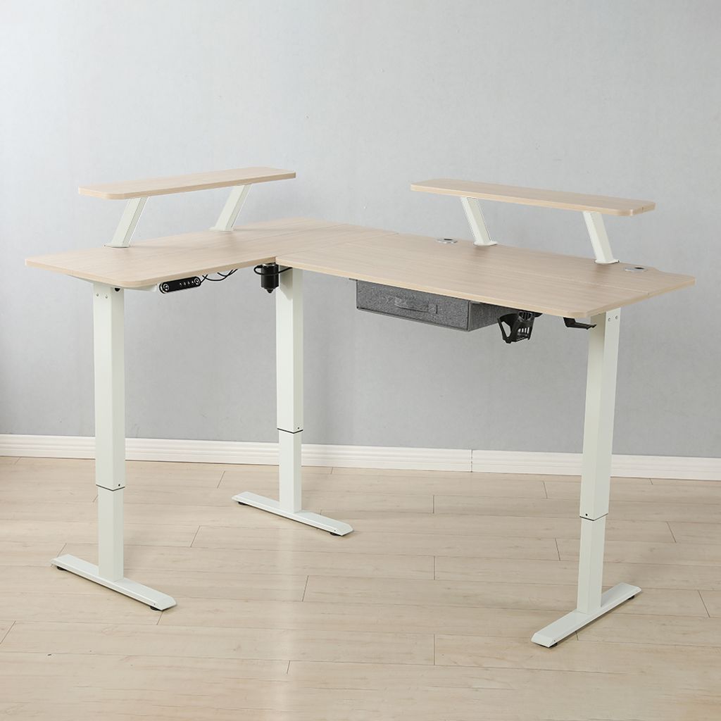 An L-shaped standing desk with monitor shelves and a drawer.
