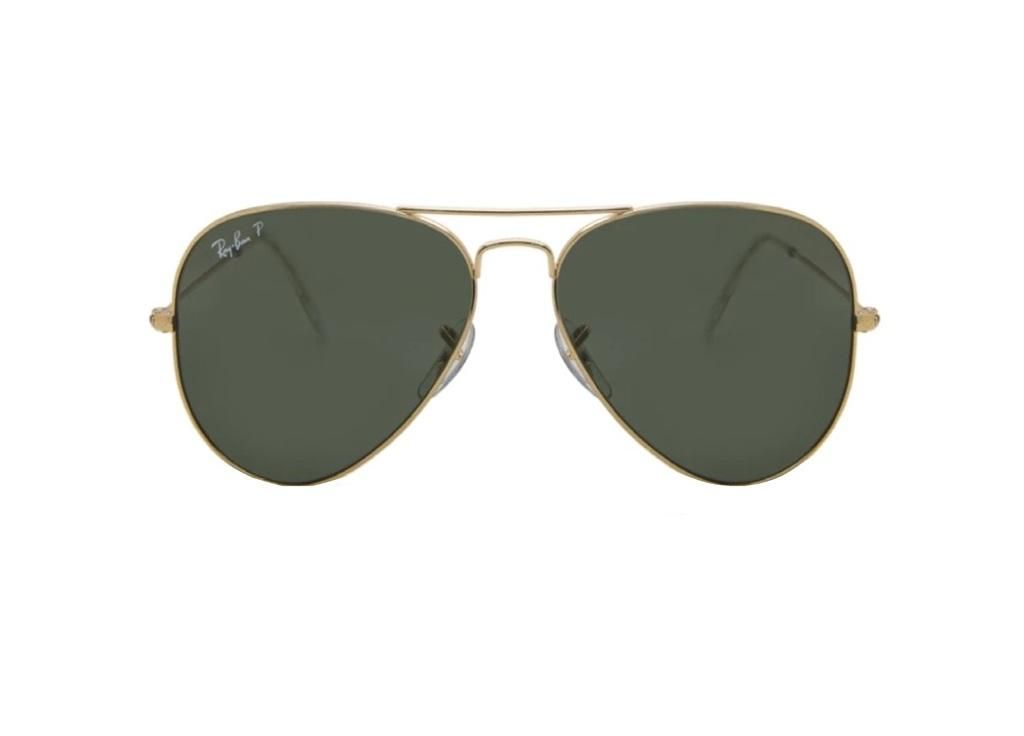 A pair of gold-rimmed aviator sunglasses with green lenses against a white background.