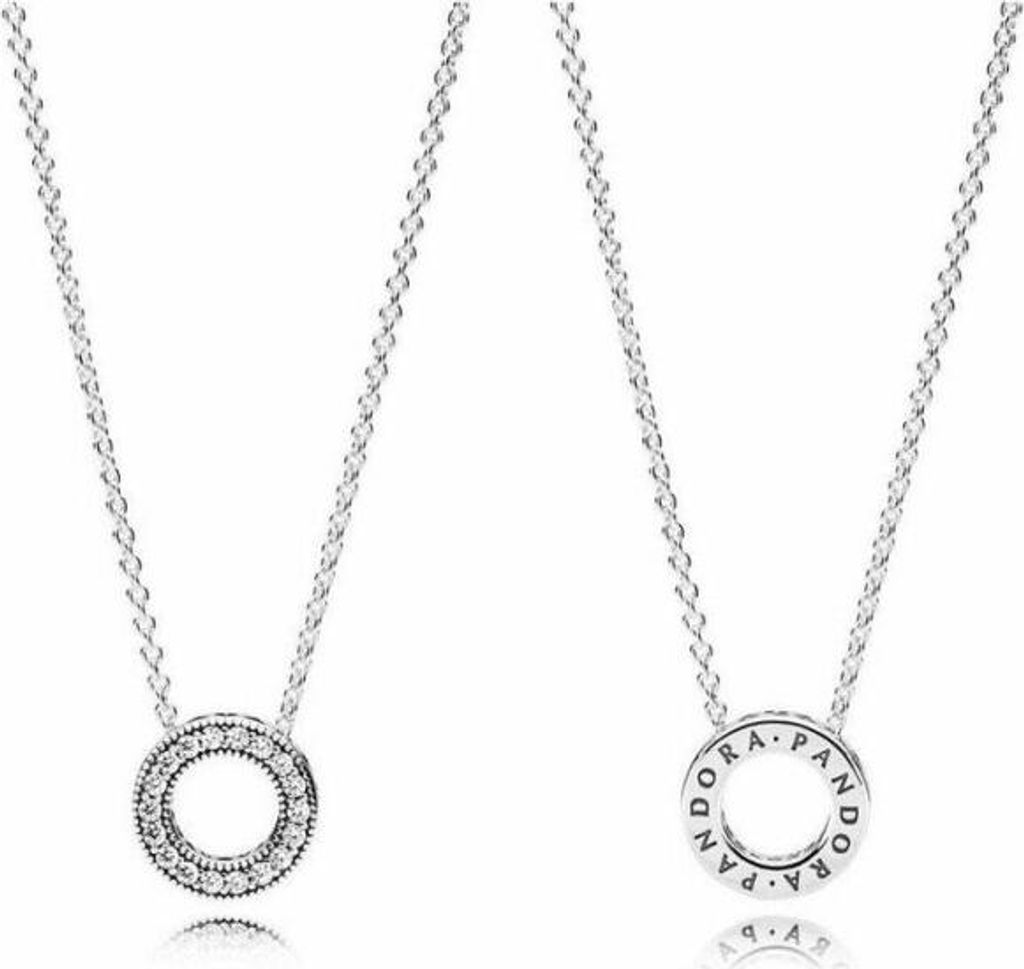 Two silver necklaces with circular pendants on a white background.