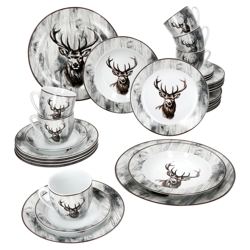 A collection of dinnerware with a stag motif, including plates, bowls, and cups, arranged on a white background.