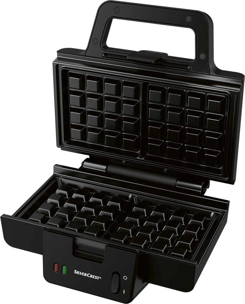 An open black waffle maker with its interior waffle grid visible.