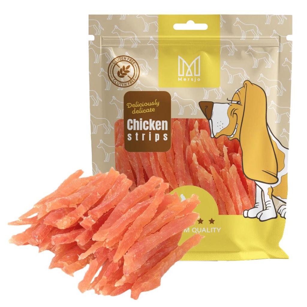 A bag of dog treats with some treats spilled in front.