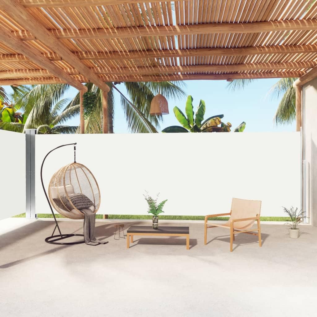 An outdoor patio area with furniture and a retractable side awning.